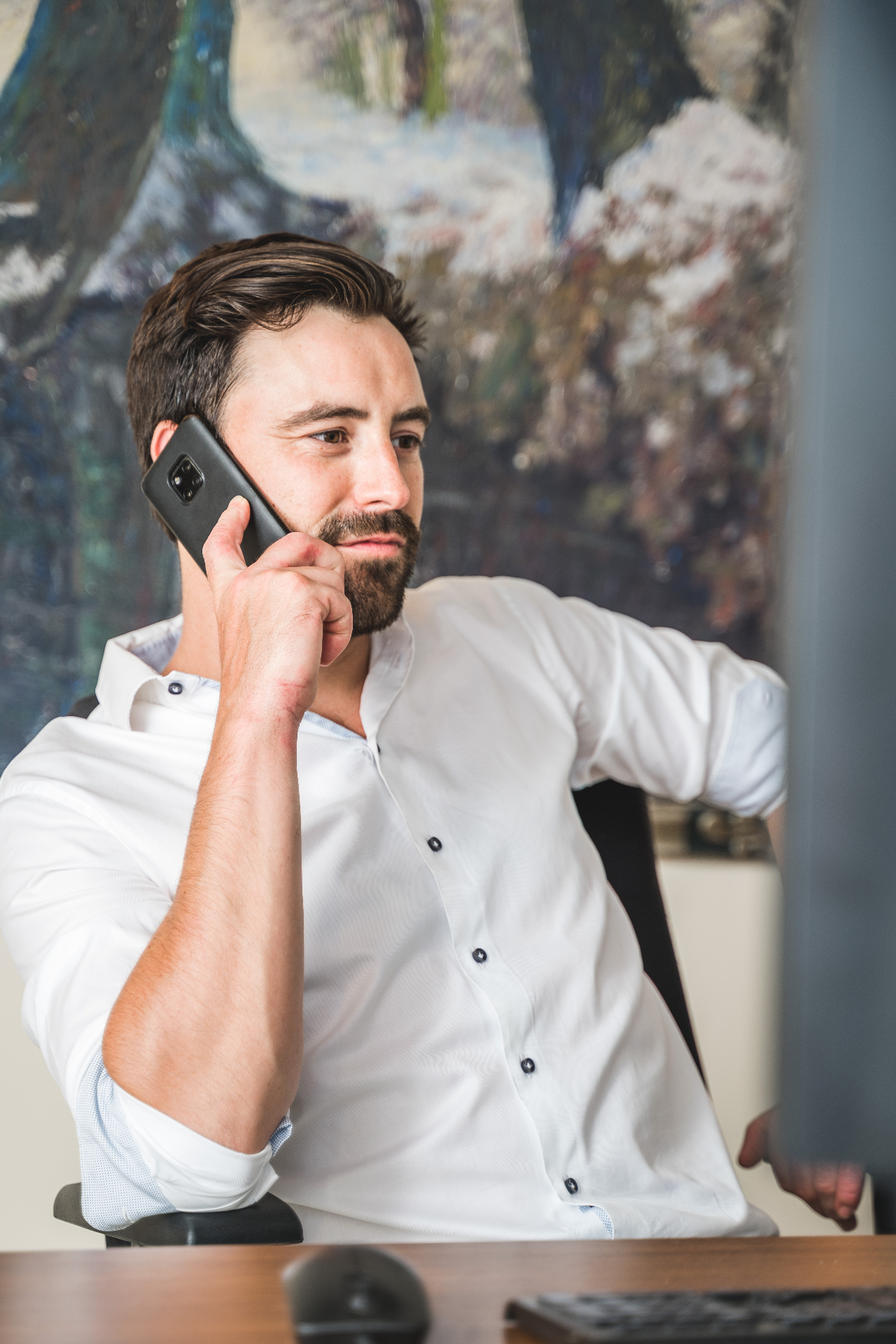 Mr. Peter-Jan De Meulenaere in gesprek met cliënt